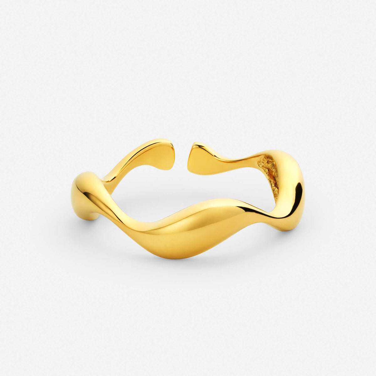 Gold adjustable wave ring with a flowing band and two open ends