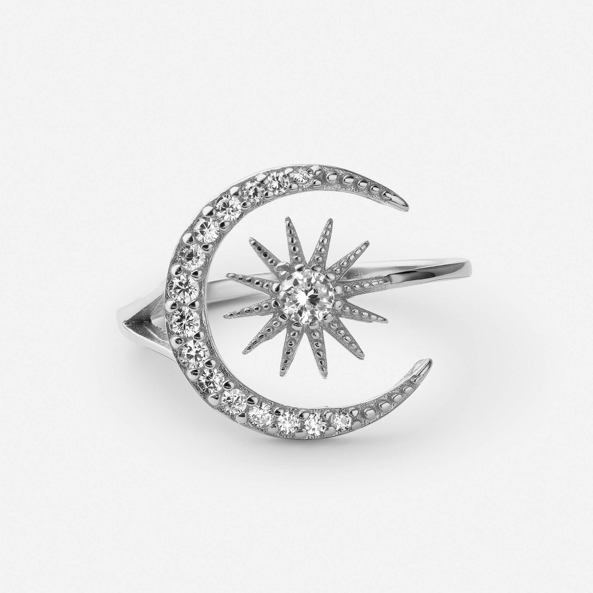Silver adjustable sun and moon ring with clear stones on the crescent and the sun